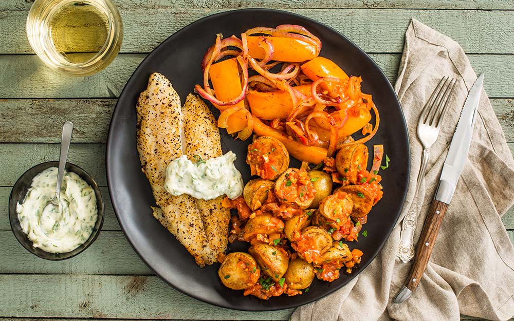 Spanish Baked Fish with patatas bravas and herb aioli,