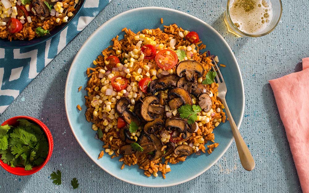 Plant-Powered Portobello Burrito Bowl with Mexican spiced rice and a summer corn salsa,