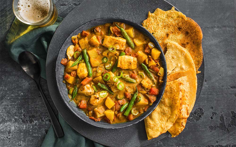 South Indian Fish Curry with potatoes and chickpea pancakes,