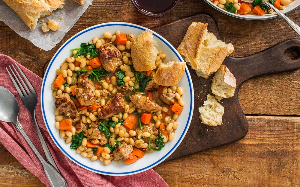 Pork Sausage Cassoulet with navy beans, herbes de Provence and French baguette,